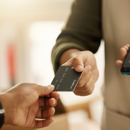 Credit card, payment and fintech with hands of people in store for pos machine, retail and shopping. Digital, purchase and register with closeup of customer and cashier for economy, trade and finance.